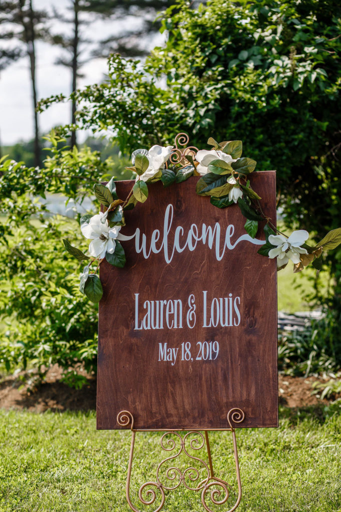 wooden welcome sign for ceremony
