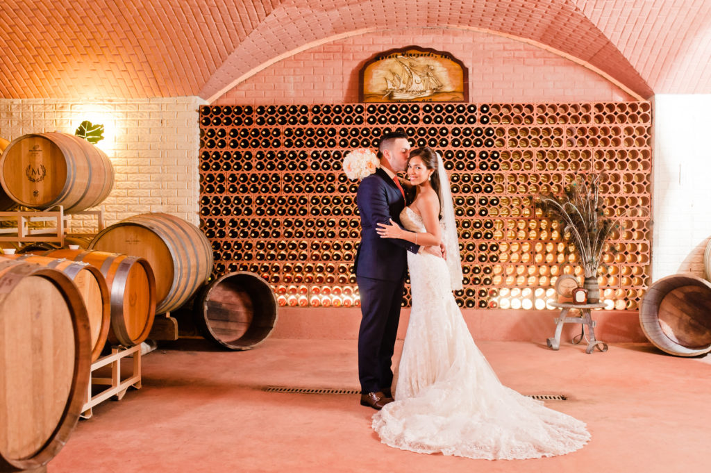 bride and groom at Morais Vineyards wine vault