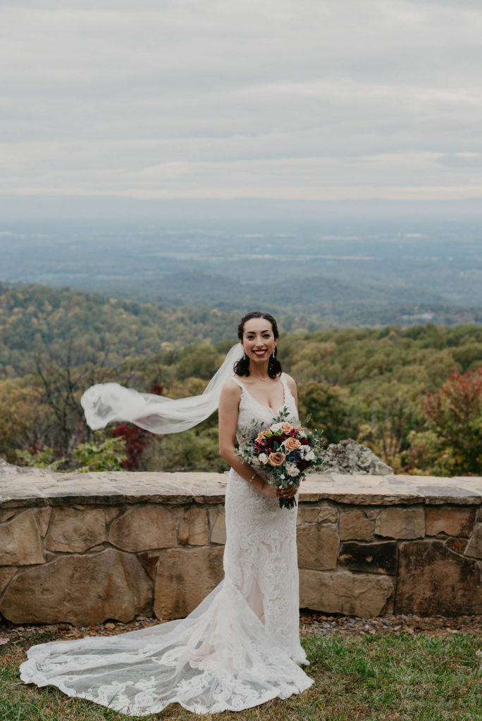 bride holding bouquet in the blue ridge cliff at Blue mountain lodge