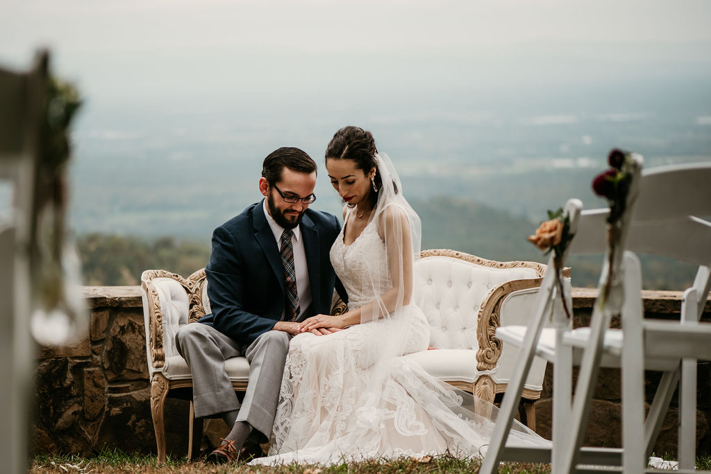 bride and groom on vintage chairs