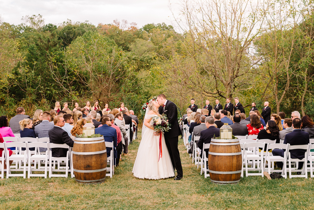bride and groom kissing at 48 fields outdoor ceremony space