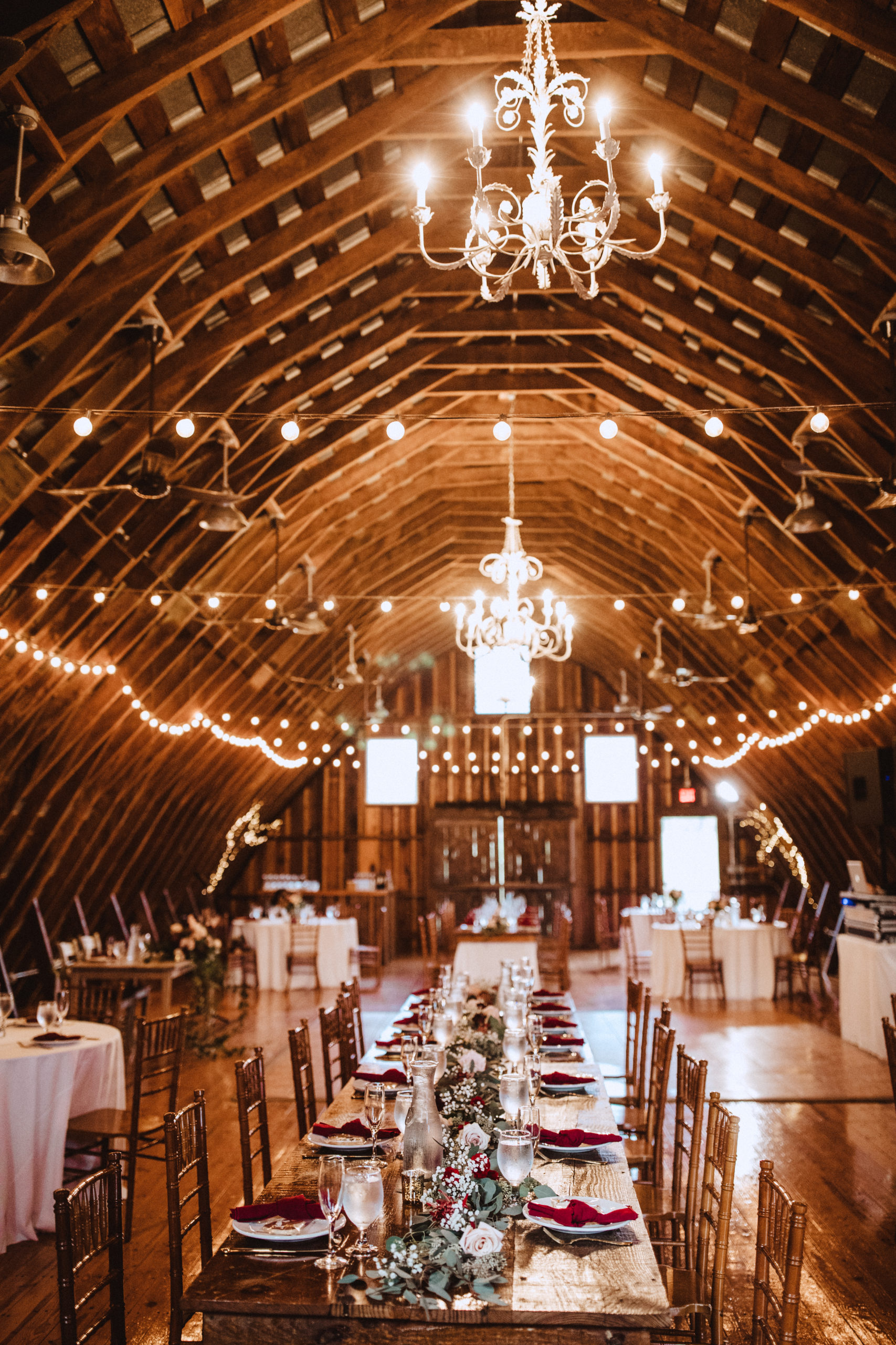 East Lynn Farm hayloft set up for a wedding with farm tables